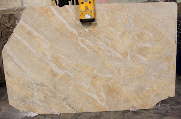 Golden tan marble slab with light white vanning