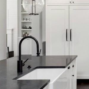 Black quartz with undermount white sink countertop.