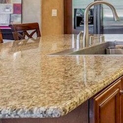 Gold background with black dots granite kitchen countertop.