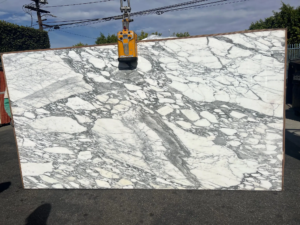 ARABASCATO CORCHIA Calacatta Caldia – Pale white marble with subtle gold and gray veins; sophisticated and serene appearance.