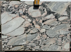 VIOLA NORTE DAME Viola Norte Dame – Dramatic white marble with deep plum and wine-colored veins; bold and luxurious centerpiece stone.