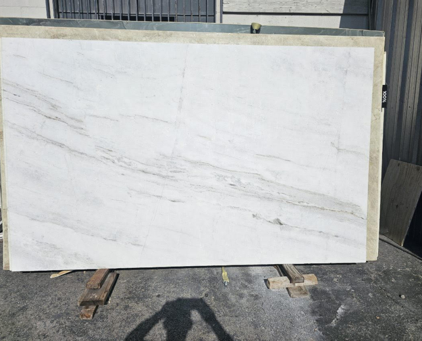 Pure white background with thick, elegant gray veining.